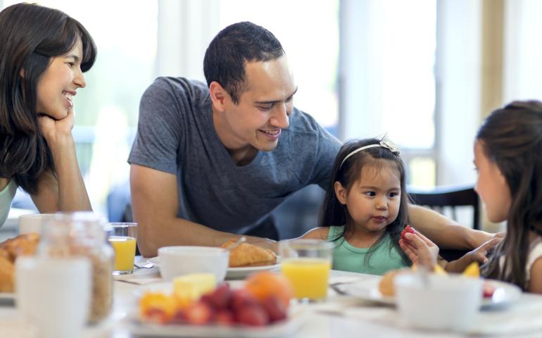 family eating breakfast together